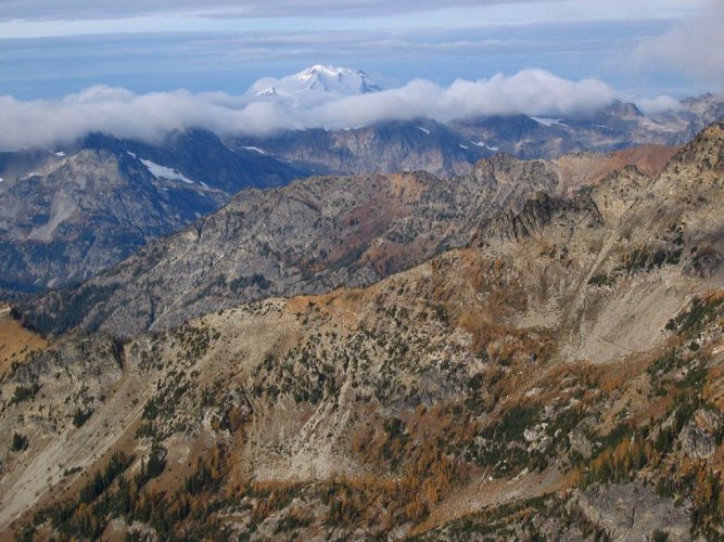 Glacier Peak was wreathed in clouds to the west.
Saska Pass is at the center of the picture.
You can see part of the Saska Pass trail cutting through a talus field at right center.